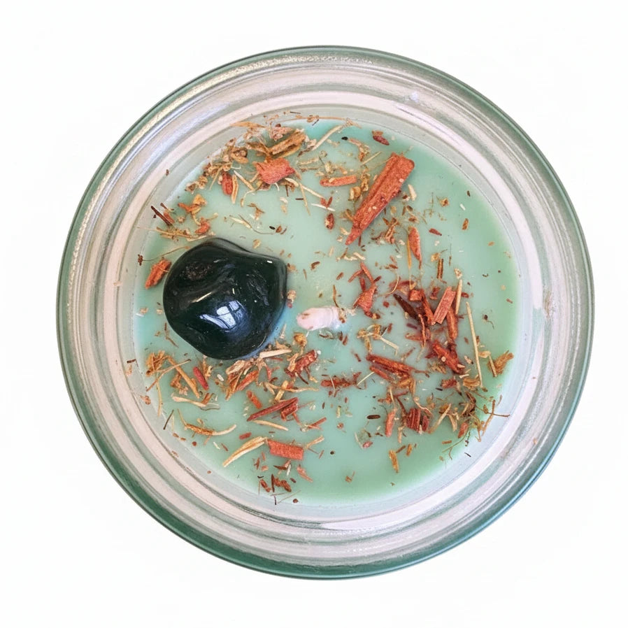 Candle in a glass jar with decorative elements on a natural background