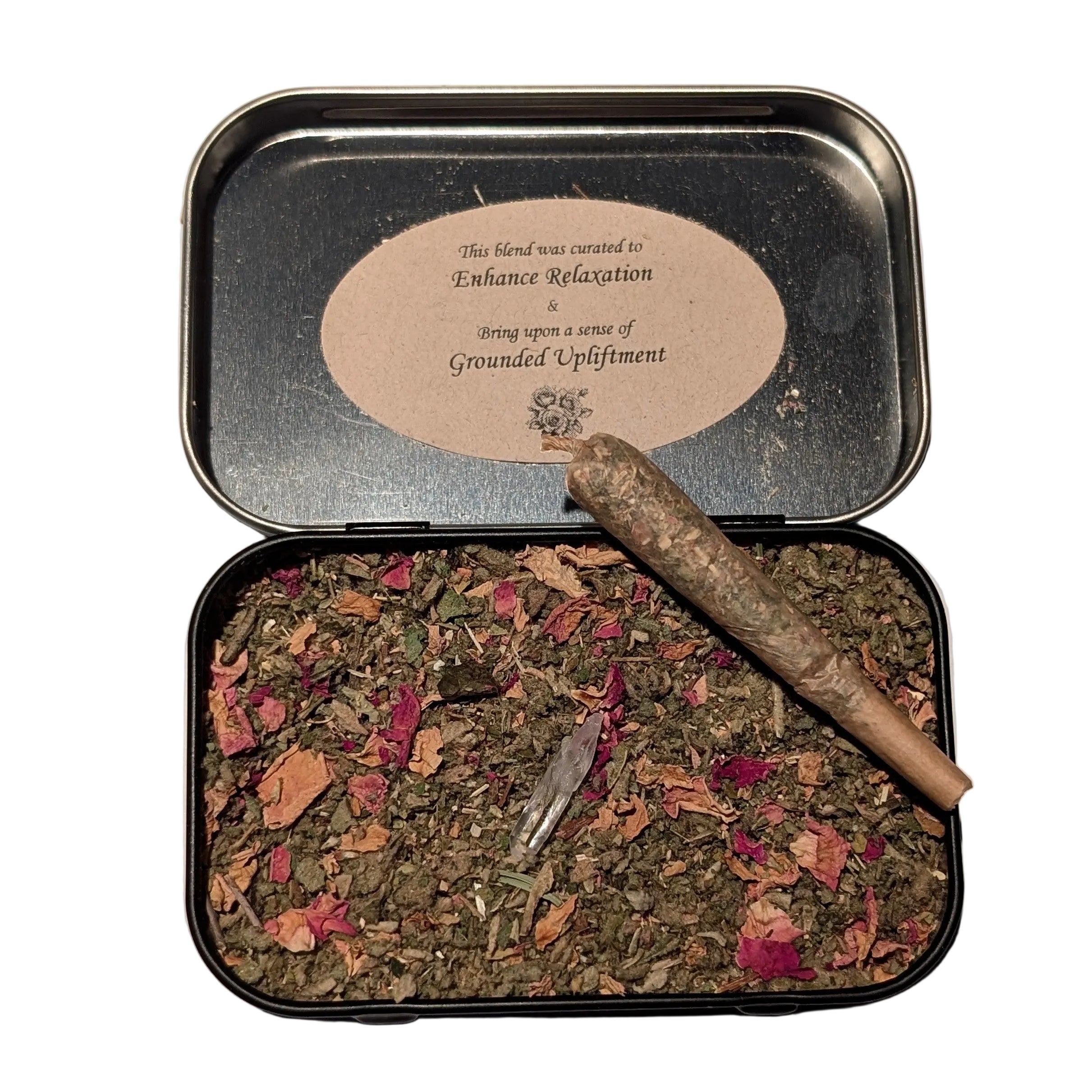 Open tin containing dried herbs and a stick, with a label on a beige background