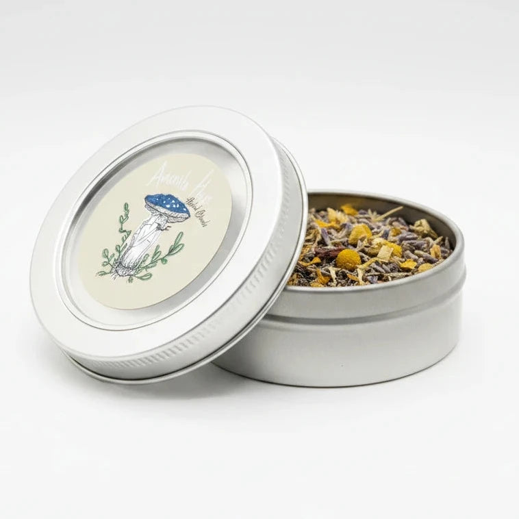 Tea tin with a label featuring a mushroom illustration on a floral background
